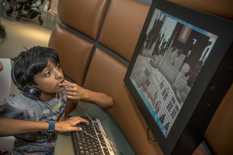 Families exploring the museum using iPads
